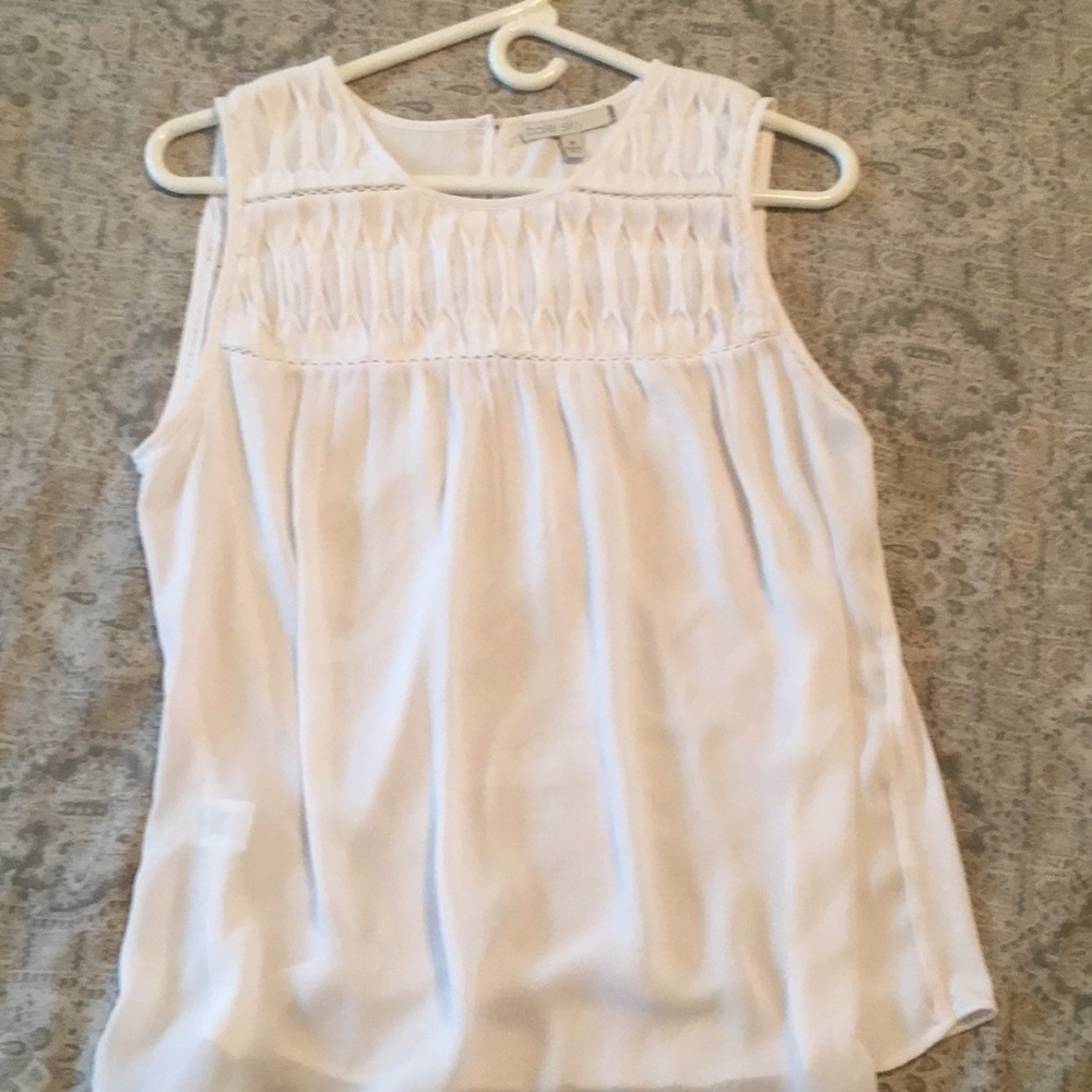 White sleeveless blouse